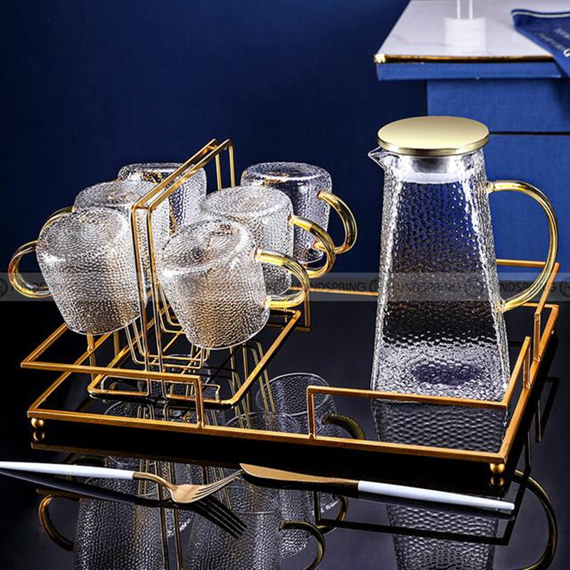 Sculpted Elegance: Hammered Borosilicate Glass Water Set with Pitcher and Cups Sculpted Elegance: Hammered Borosilicate Glass Water Set with Pitcher and Cups