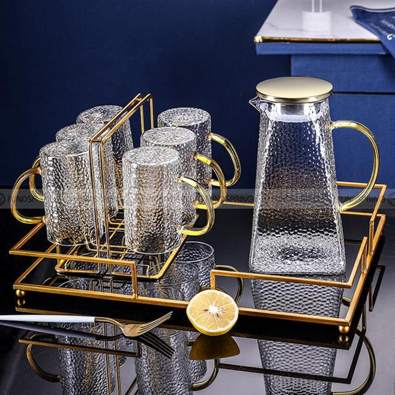 Sculpted Elegance: Hammered Borosilicate Glass Water Set with Pitcher and Cups Sculpted Elegance: Hammered Borosilicate Glass Water Set with Pitcher and Cups